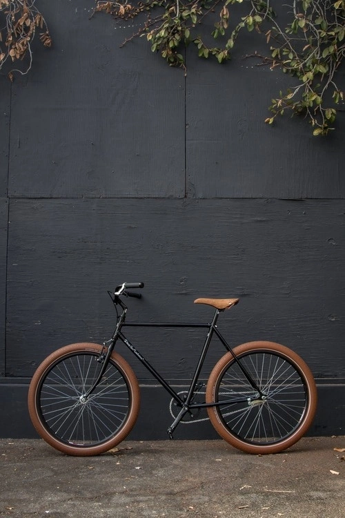 Black single speed bike with tan leather seat – Murray Mitchell