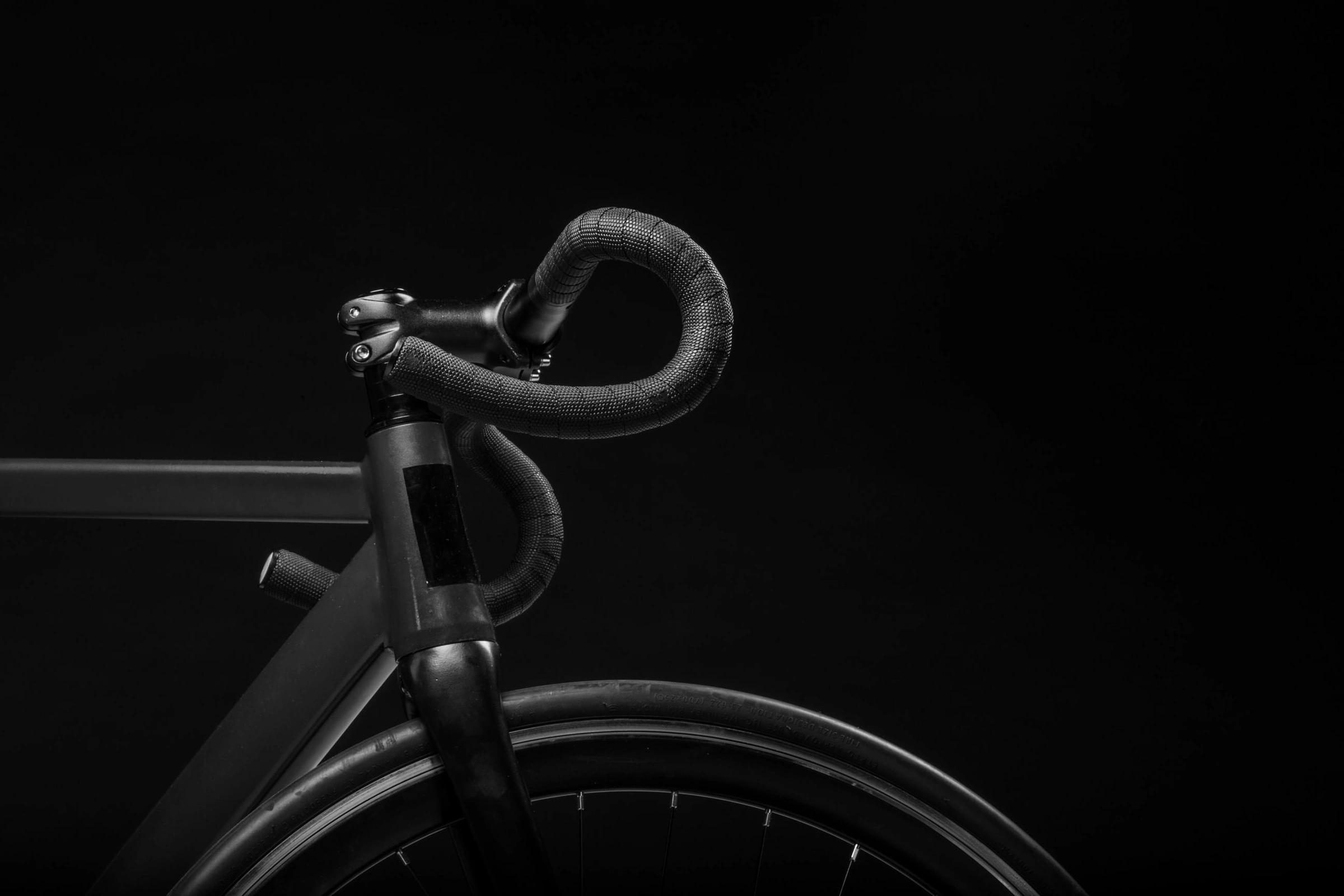 black road bicycle handle with black background