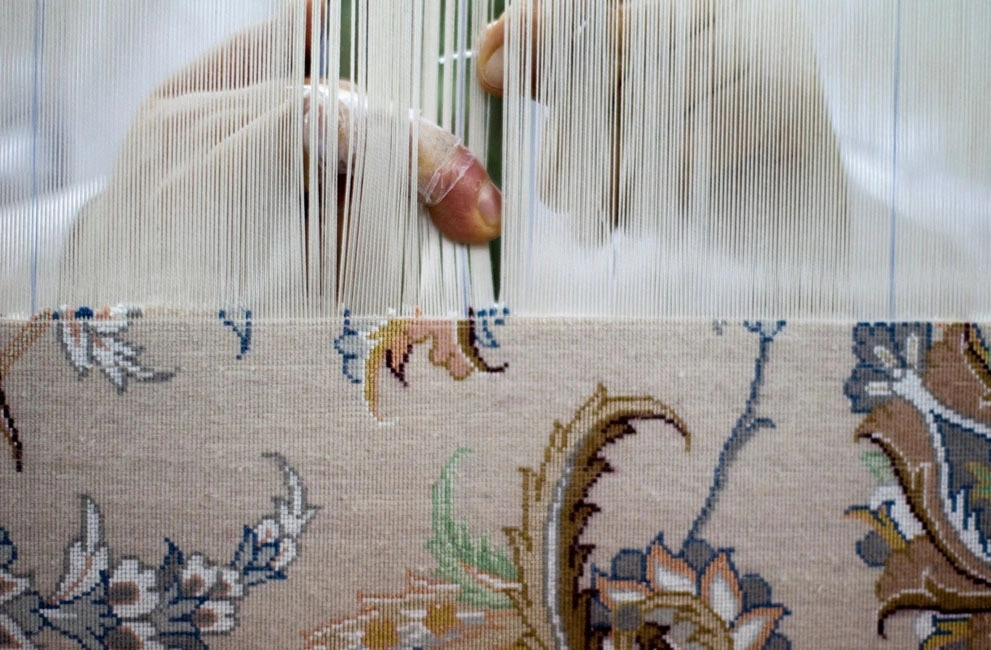 sufiness:
“A weaver works on a carpet at a carpet workshop in Isfahan, Iran
”