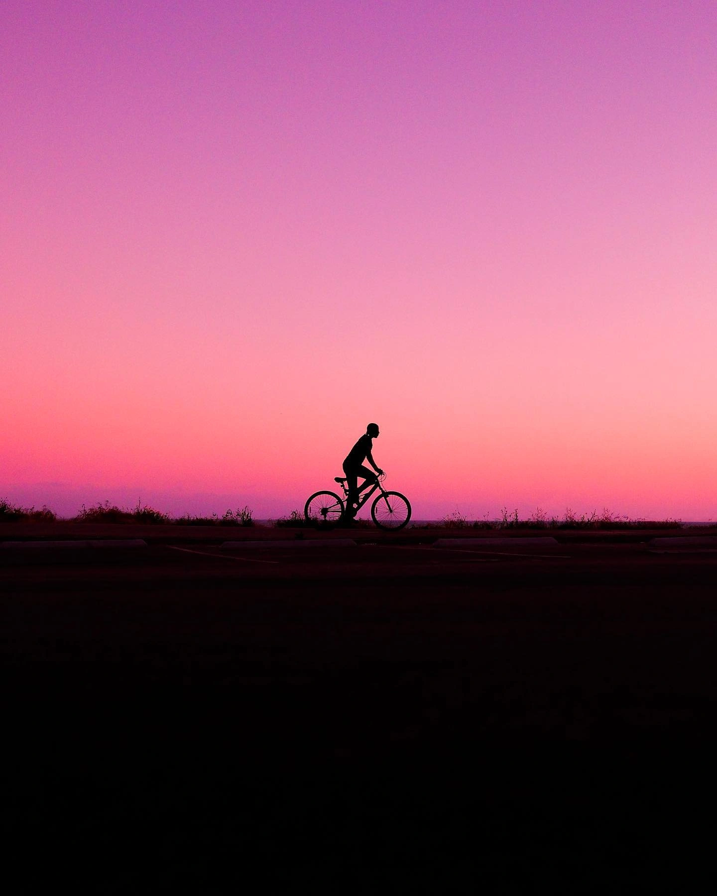 Photo by STREET in The Beach. May be an image of 1 person, bicycle and twilight.