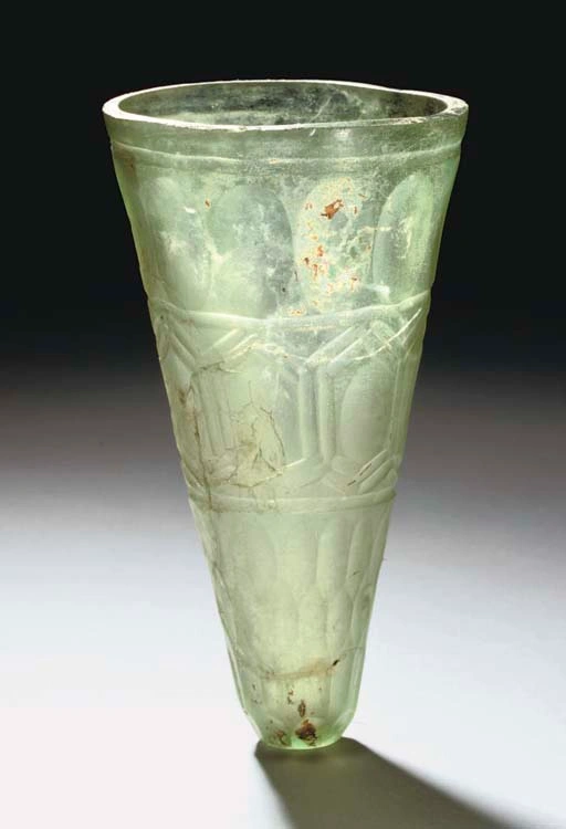 A SASSANIAN WHEEL CUT GLASS BEAKER