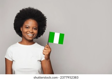 Nigerian woman holding flag of Nigeria Education, business, citizenship and patriotism concept