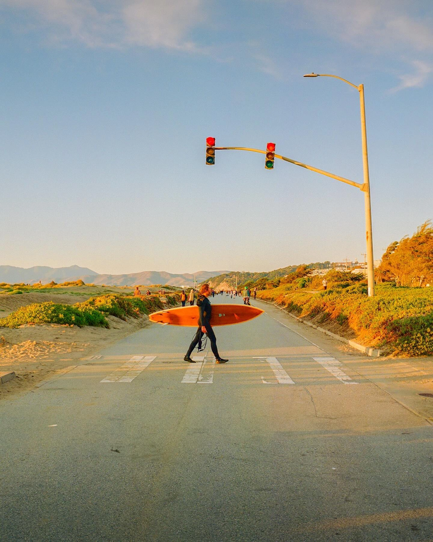 Photo by Kodak on February 11, 2024. May be an image of 3 people, skateboard, surfboard, road, telephone pole, lamppost and curb.