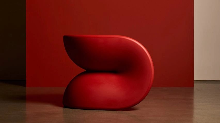 Red chair against a red backdrop