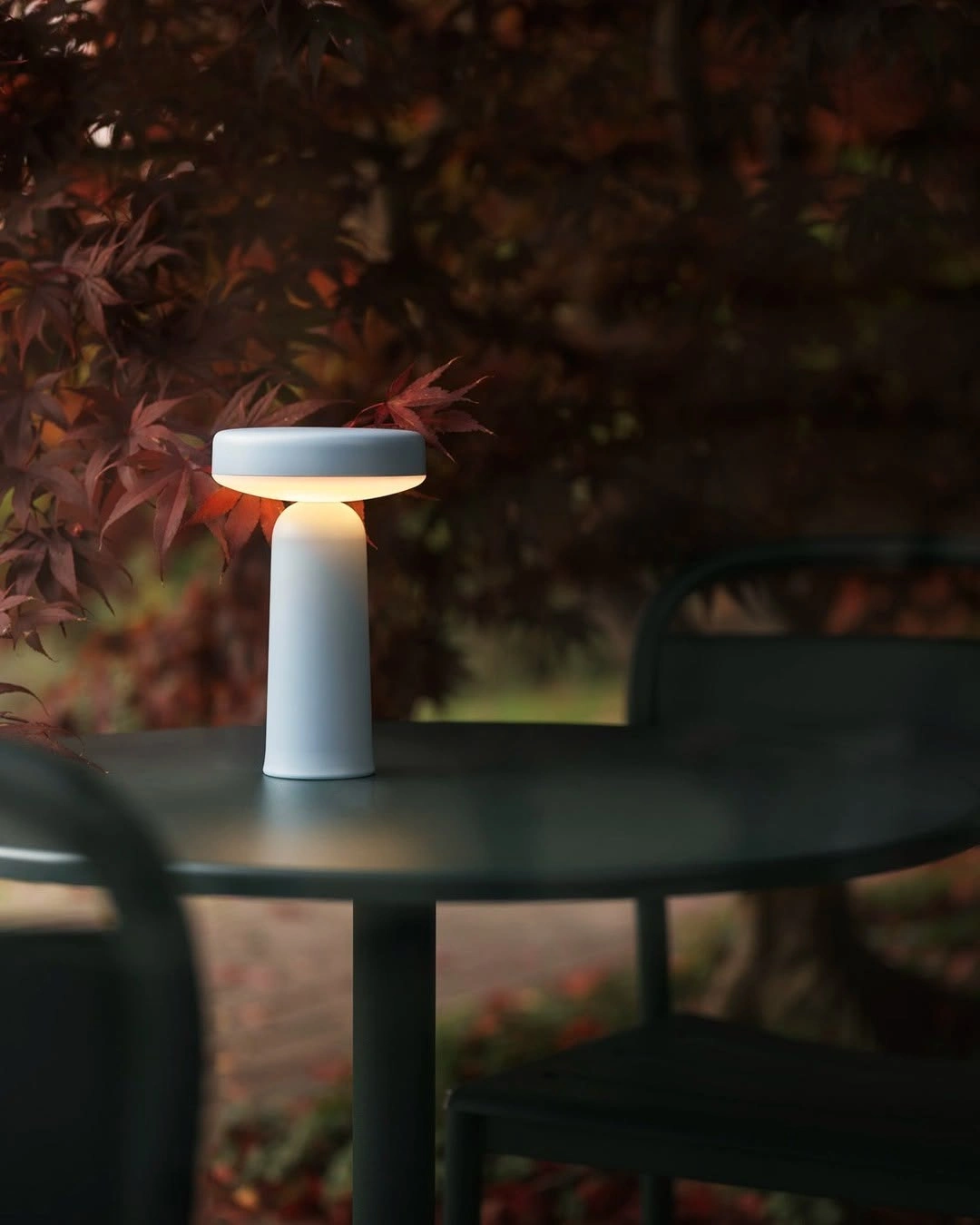 Photo by Muuto on October 15, 2024. May be an image of lantern, lamp, lamp shade, bird feeder and candle.