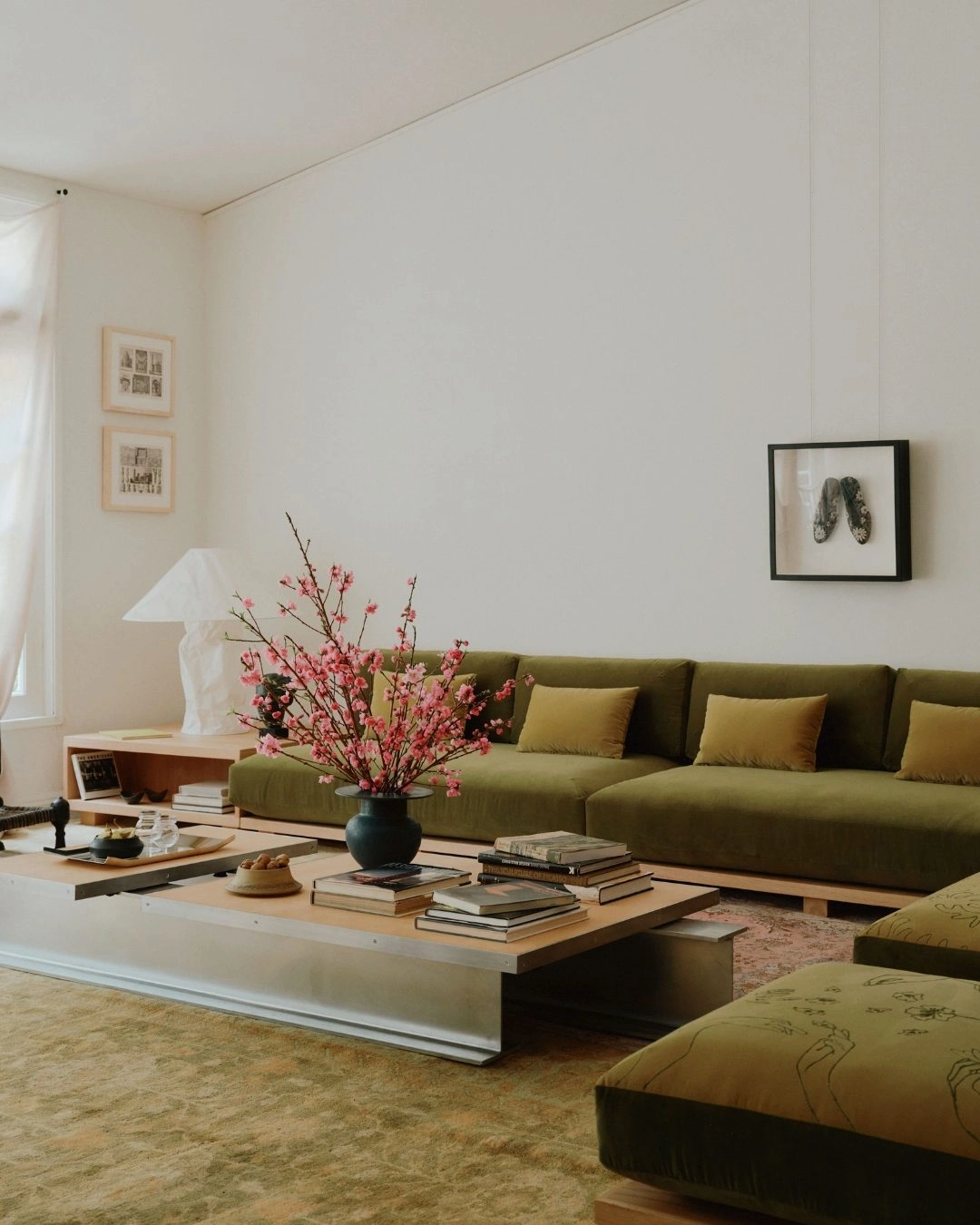 Photo by Architectural Digest on February 24, 2025. May be an image of armchair, sofa, chaise longue, living room, indoors and text.