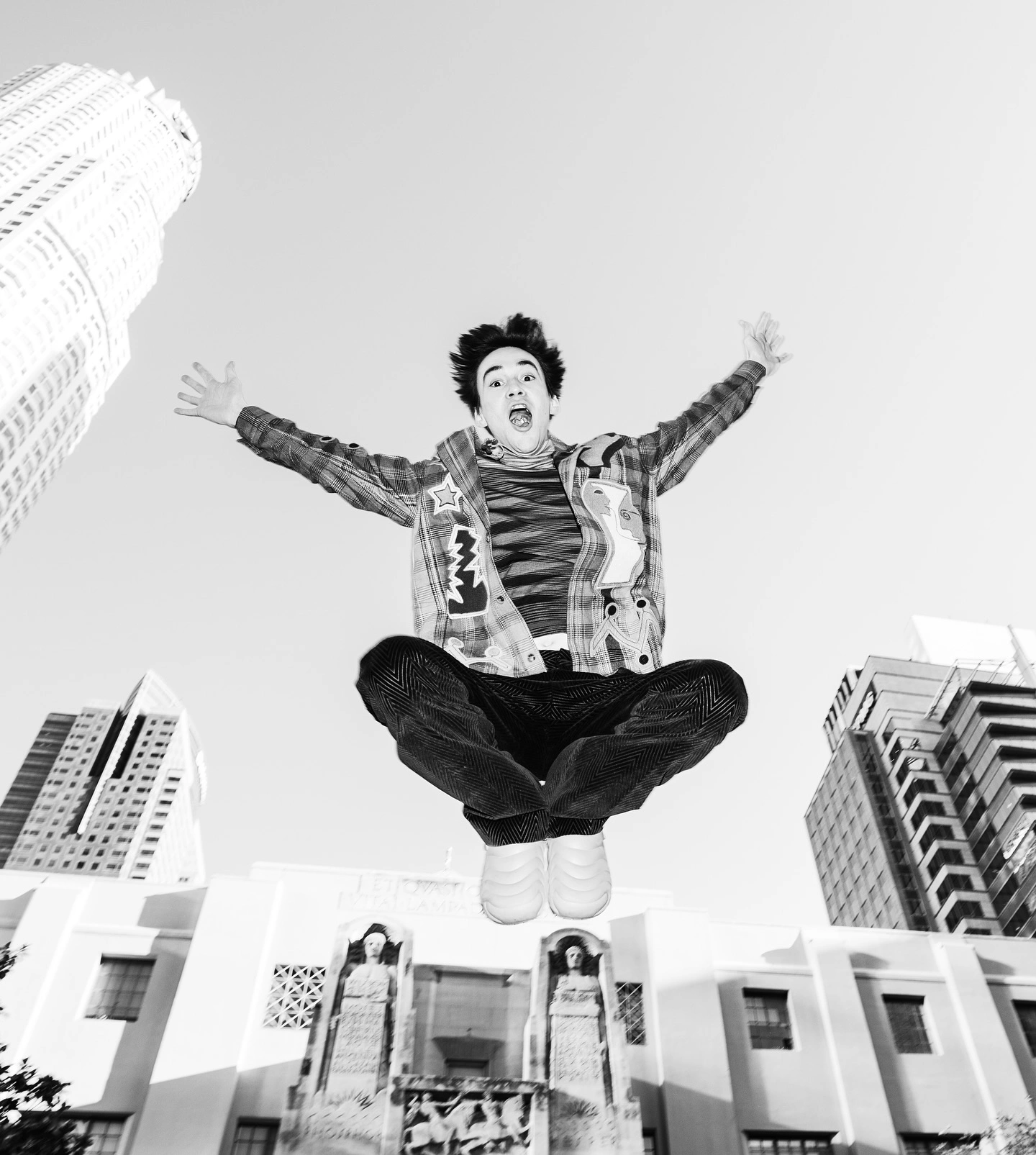 Photo shared by annie on March 12, 2025 tagging @jacobcollier, and @scumner.world. May be a black-and-white image of 1 person, skydiving, trampoline, skyscraper, tower, buildings and text.