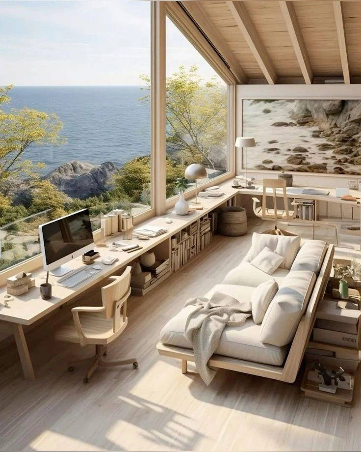 This may contain: a living room filled with furniture next to a large window overlooking the ocean and mountains