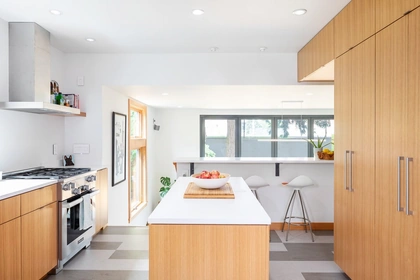 Kitchen, Recessed Lighting, Engineered Quartz Counter, Range, Ceramic Tile Backsplashe, Undermount Sink, Wood Cabinet, Range Hood, and Linoleum Floor Kitchen  Photo 3 of 10 in Ballard Residence by Jim Burton Architects