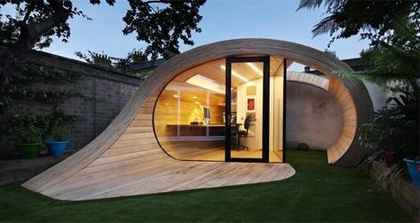 Organic Shaped Backyard Office Doubles as a Storage Shed
