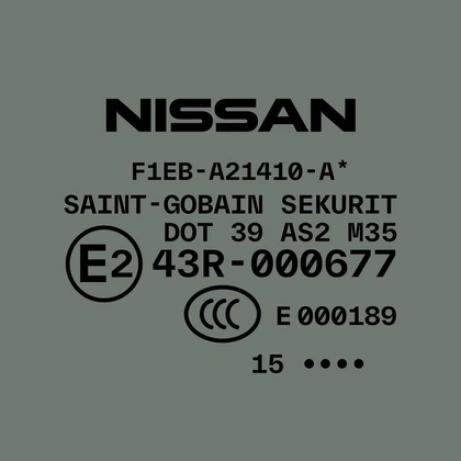 Photo by TYPE.WELTKERN® on December 08, 2021. May be an image of text that says 'NISSAN F1EB A21410- SAINT GOBAIN SEKURIT DOT 39 AS2 M35 E2 43R- 000677 E000189 15...'.