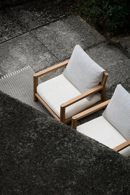 two outdoor armchairs