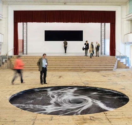 Anish Kapoor’s Dark Whirlpool Installation Churns Ceaselessly Beneath An Old Movie Theater