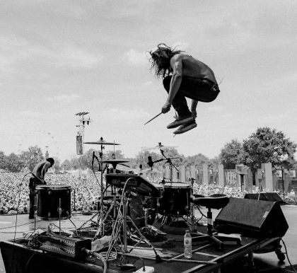 Photo shared by Aric Improta on May 23, 2022 tagging @v.trvn, @vans_europe, @roland.creatives, @hellfestopenair, @remopercussion, @officialtamadrums, @meinlcymbals, and @fever333. May be an image of 2 people and outdoors.