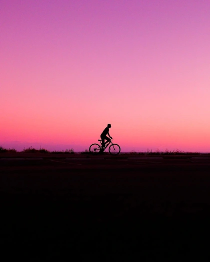 Photo by STREET in The Beach. May be an image of 1 person, bicycle and twilight.