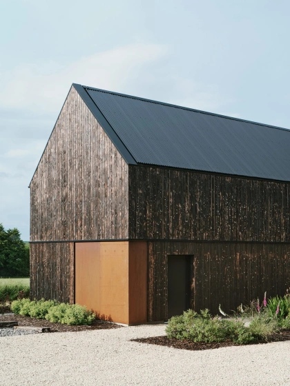 Loader Monteith adds charred-timber-clad office to brownfield site