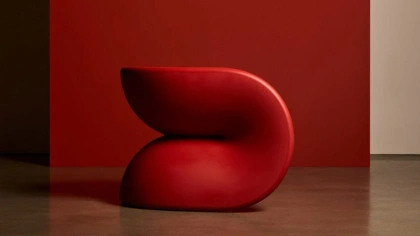 Red chair against a red backdrop