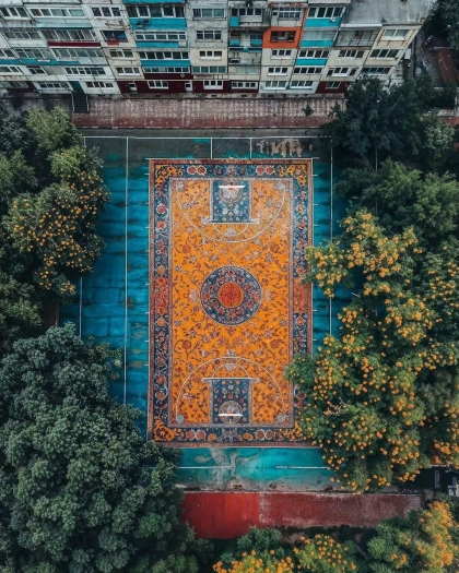 Photo by designboom magazine on October 05, 2024. May be an image of basketball, buildings, outdoors and basketball court.