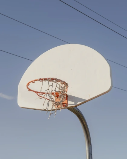 Photo by Jason Hunter on January 17, 2025. May be an image of basketball, backboard, ball, basketball court, telephone pole and text.