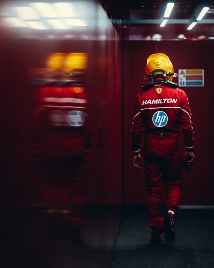 Photo by Lewis Hamilton on March 14, 2025. May be an image of 1 person, racing a vehicle, helmet, poster and text that says 'HAMILTON n'.