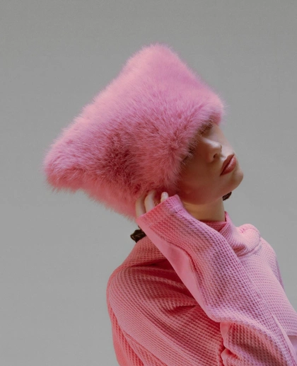 Photo by @mona_thomas on March 15, 2025. May be an image of 1 person, make-up, fur coat, hat, beret, polo neck and text.