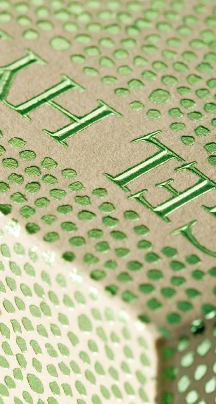 Stamped green foil with abstract dot pattern. www.kurzusa.com